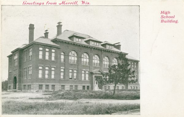 View toward the high school. Caption reads: "Greetings from Merrill, Wis.," and "High School Building."