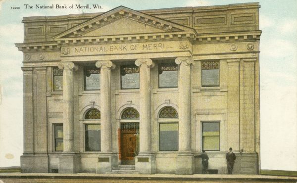 Exterior view of the front of the National Bank of Merrill. Two men are standing against the building on the right. There are signs on the second-story windows for "Reid Smart & Curtis Law Offices." Caption reads: "The National Bank of Merrill, Wis."