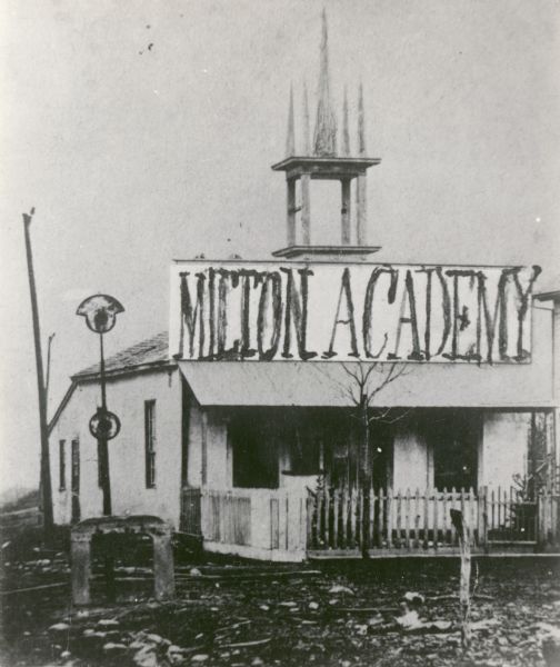 In 1844 Joseph Goodrich founded Milton Academy and built the first gravel and mortar building in the town. (Note that the Milton House is often called the first "concrete" building, but this building pre-dates the Milton House by several years). The Rev. Betheal C. Church was the first instructor. In 1848 it was chartered under the name of Du Lac Academy, but was changed to Milton Academy in 1854. In 1855, a larger building replaced the use of this one.