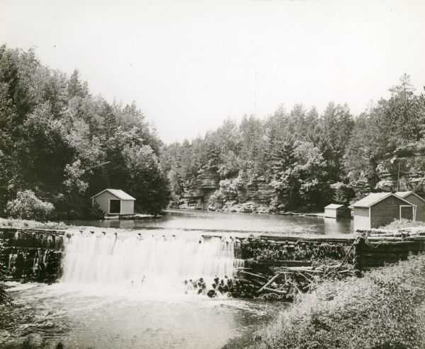 View of the mill dam on Dell Creek that creates Mirror Lake in Mirror Lake State Park (although the photograph was taken before the site was designated as a state park).