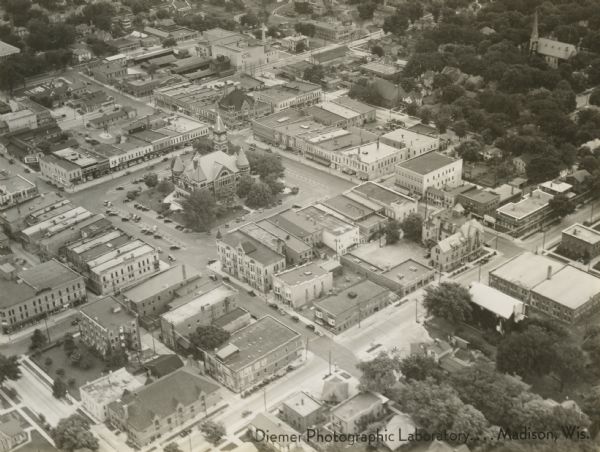 Aerial view of church and surrounding buildings.