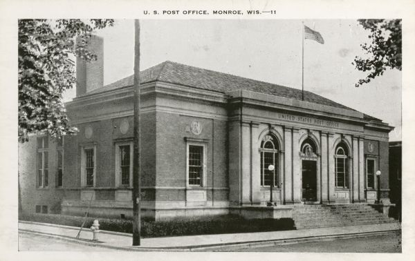 Exterior view of the U.S. Post Office. Caption reads: "U.S. Post Office, Monroe, Wis."