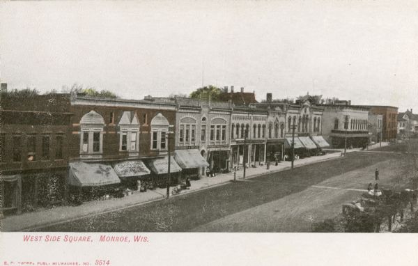 Elevated view across street of the West Side Courthouse Square. Caption reads: "West Side Square, Monroe, Wis."
