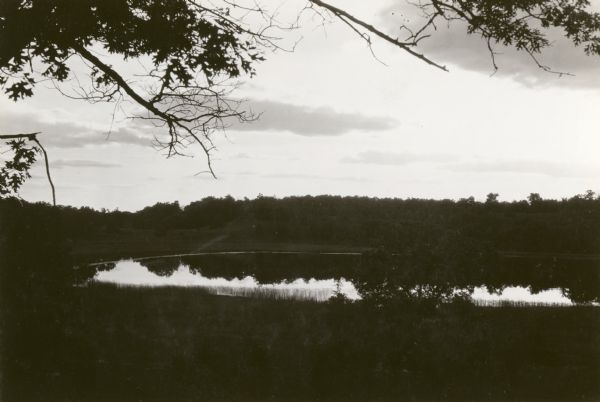 View of Fountain Lake (officially known as Ennis Lake), John Muir's boyhood home near Montello. The area is now a 125-acre State Natural Area. Fountain Lake Farm was designated a National Historic Landmark on June 21, 1990.
