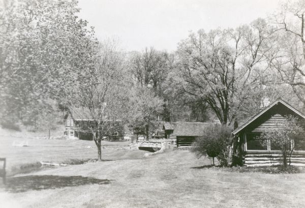Buildings at "Little Norway." From left to right: main lodge (formerly Haugen barn), summer kitchen, tool house, and guest house.