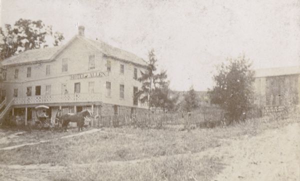 Allen's hotel. A horse-drawn vehicle is in front of the hotel.