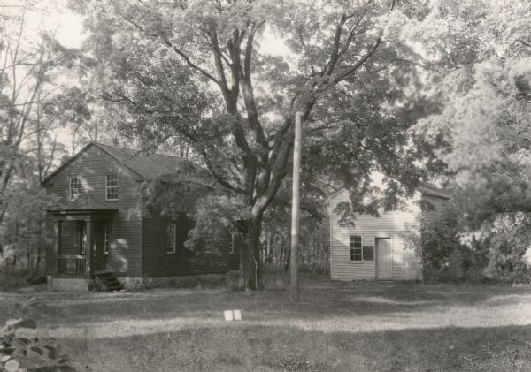 Nashotah Mission, Blue House and Red House. The Blue House (right) was the first building of the mission, built in 1842. The Red House was built in 1843 for use as a chapel. This was one of the first schools of higher learning in Wisconsin.