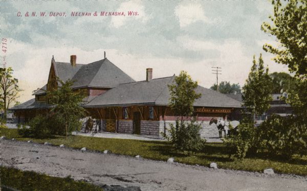Chicago & Northwestern Railway Passenger Station. Side view with two horses standing next to station. Caption reads: "C. & N. W. Depot, Neenah & Menasha, Wis."