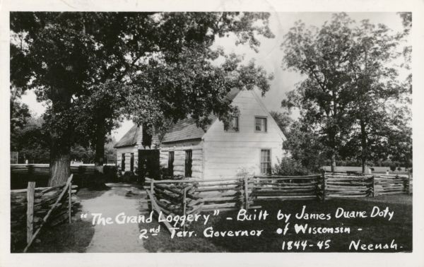 Side view of the home of James Duane Doty on Doty's Island, "the loggery." Caption reads: "'The Grand Loggery' — built by James Duane Doty, 2nd Terr. Governor of Wisconsin — 1844-45, Neenah."