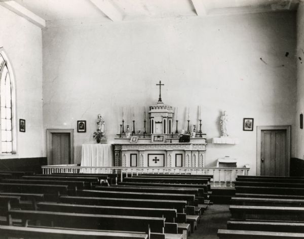 Interior view across pews towards the altar of St. Augustine Church.
