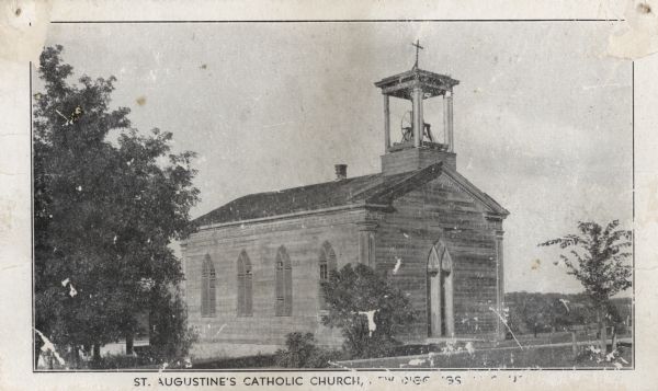 St. Augustine's Roman Catholic Church. Built by Rev. Samuel Mazzuchelli in 1844. Caption reads: "St. Augustine's Catholic Church [text obscured]."