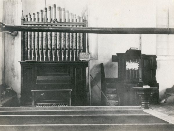 Interior view of Zwingli Reformed Church with pulpit and organ.