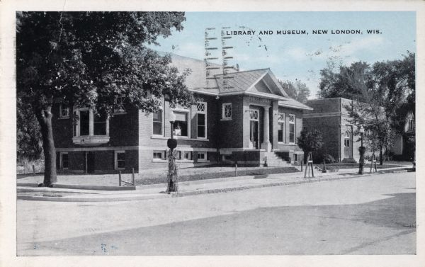 Exterior view across street towards the library and museum. Caption reads: "Library and Museum, New London, Wis." 