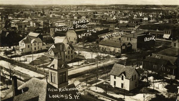 View looking southwest. Labeled on photograph: Post Office, Beebes Drugs, Opera House, Fair Store, Bank. Caption reads: "New Richmond, Wis. Looking S.W."