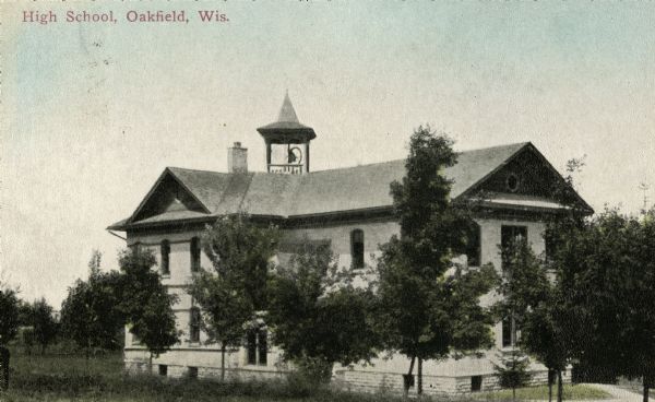Exterior view of the high school. Caption reads: "High School, Oakfield, Wis."