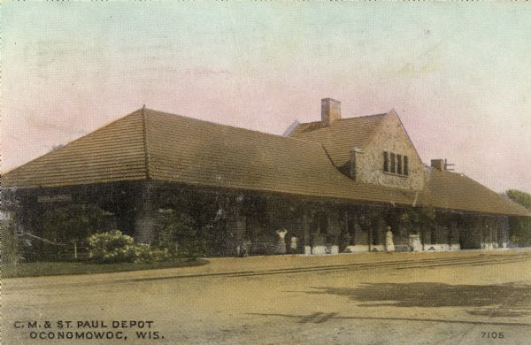 Exterior of depot. Caption reads: "C. M. & St. Paul Depot, Oconomowoc, Wis."