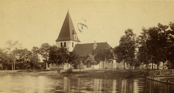 View across water towards a church.