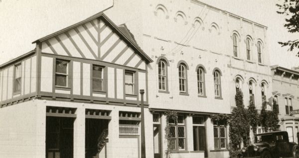 Exterior view of the Oconomowoc Public Library, located in both the half-timbered building (formerly the fire house) and the next building, with a museum on the third floor.