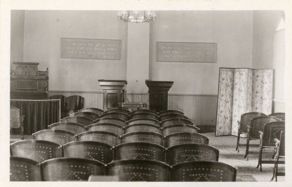 Interior of Church of Christ, Christian Scientist church, built in 1886, the first Christian Scientist church outside of Boston and the first in America built for this purpose. Two signs on the back wall read: "Matt, 'Come unto Me all ye that labor and are heavy laden and I will give you rest.' Christ Jesus" and "'Divine Love always has met, and always will meet every human need.' Mary Baker Eddy".