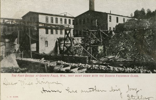 Footbridge on river. Caption reads: "The Foot Bridge at Oconto, Wis., That went down with the Oconto Freshman Class."