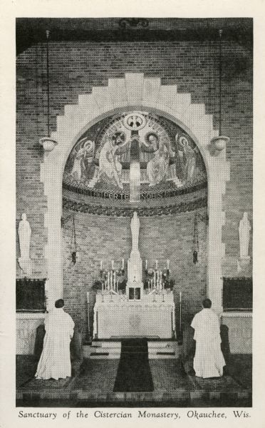 Sanctuary of Cistercian Monastery. Two men are kneeling down before the altar. Caption reads: "Sanctuary of the Cistercian Monastery, Okauchee, Wis."