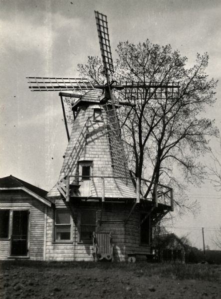 Exterior view of windmill attached to house located along the shores of Lake Michigan in the Town of Holland.