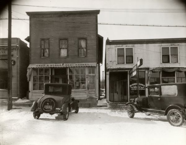 A view of Owen and Starry Meat Market. A restaurant and ice cream parlor are on the right.