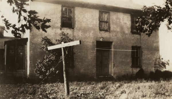 Exterior view of the Clausen farmhouse, residence of C.L. Clausen.