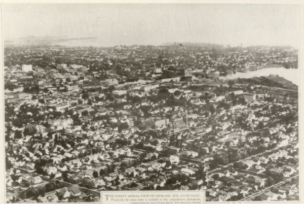 Aerial view of the city. Caption reads: "The finest aerial view of Oshkosh, Wis. ever made. Practically the entire town is included in this comprehensive photograph."