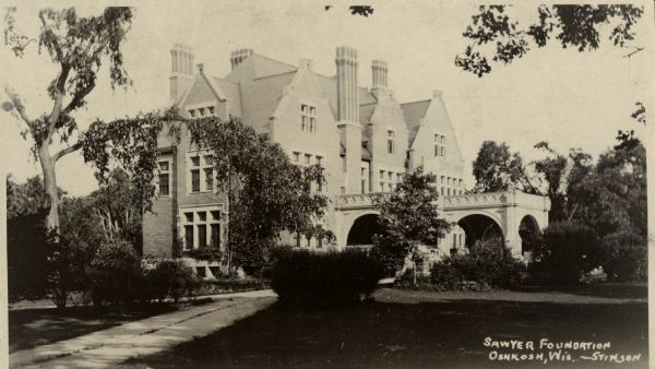 View of the Oshkosh Public Museum, formerly the Sawer Foundation and the residence of Edgar Sawyer. The home was built in 1908 and became a museum in 1924. Caption reads: "Sawyer Foundation Oshkosh, Wis. —Stinson".