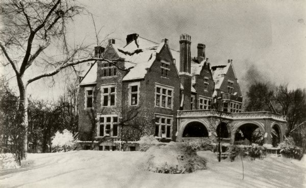 View of the Oshkosh Public Museum in the winter months with snow on the ground. Formerly the home of Edgar Sawyer. The home was built in 1908 and became a museum in 1924.