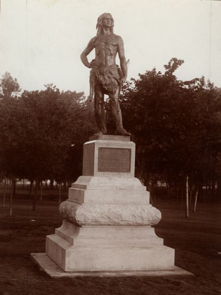 A statue of Oshkosh, head chief of the Menominee Indian Tribe in North Park (Menominee Park). Sculpted by Gaetano Trentanove of Florence, Italy. Unveiled June 21, 1911. Presented to the city by Col. John Hicks.