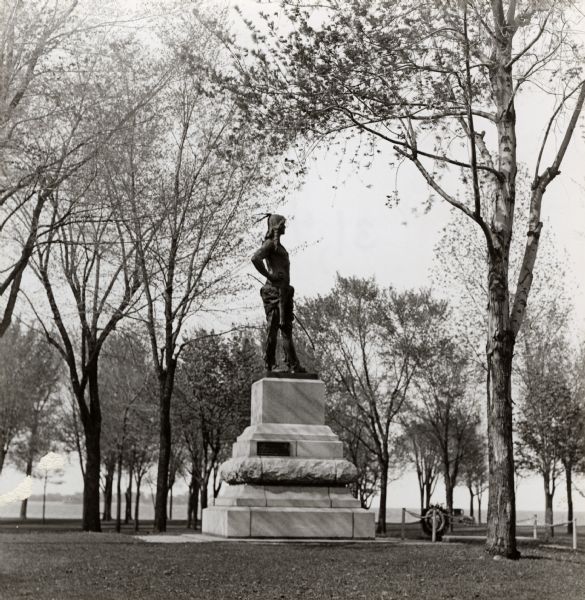 Oshkosh, head chief of the Menominee Indian Tribe. Side view of the heroic bronze statue by Gaetano Trentanove (Florentine). Unveiled June 21, 1911 in Menominee Park (formerly North Park). The statue was a gift from Colonel John Hicks.