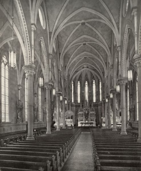 An interior view of St. Mary's Church, looking towards the altar. St. Mary's Parish was created because of the great flow of immigrants to Oshkosh. The first parish in Oshkosh, St. Peter's, could not accommodate all the newcomers.