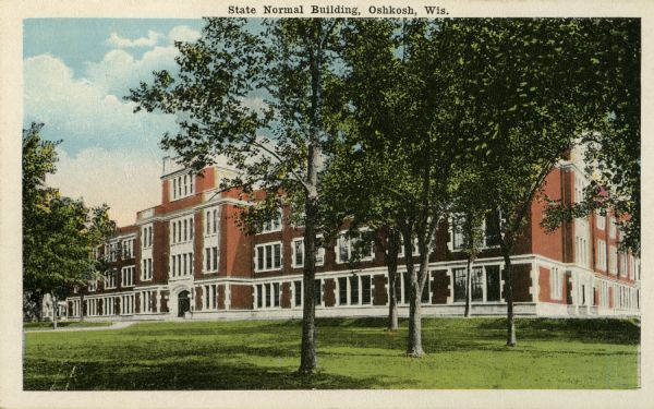 View across lawn towards the State Normal building (Dempsy Hall), at the State Normal School. This building was built in 1918, after a fire destroyed the main building in 1916. Caption reads: "State Normal Building, Oshkosh, Wis."