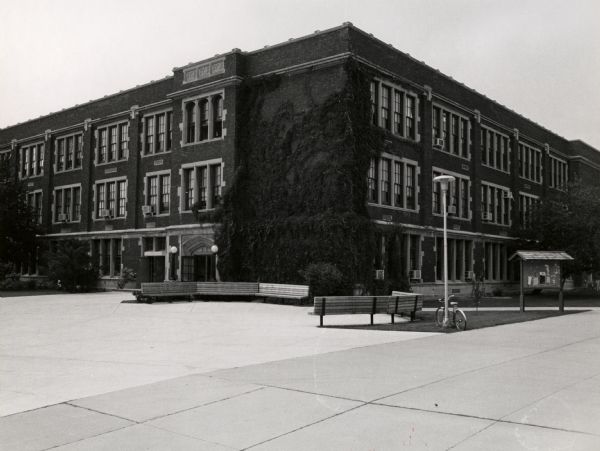 Southeast corner of Dempsy Hall at the University of Wisconsin-Oshkosh. Dempsy Hall is the oldest building currently on campus, and houses the offices of the Chancellor, Vice Chancellor, and the Provost.