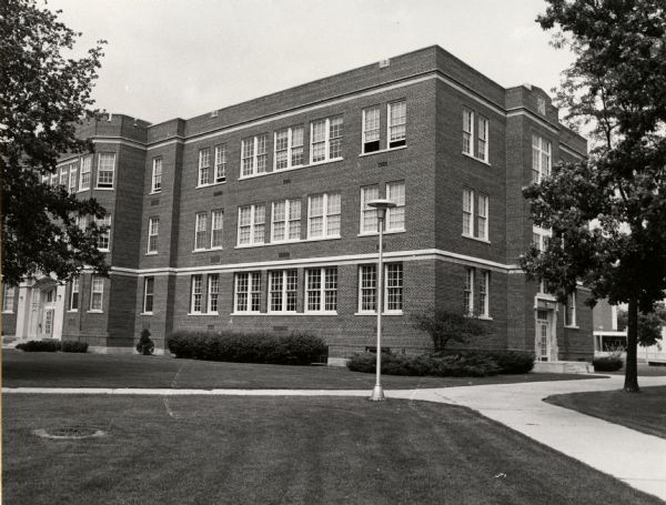 A view of the south-west corner of Swart Hall, at the University of Wisconsin-Oshkosh. This building was built in 1928, and was originally known as Rose C. Swart Training School. In the entrance hallway, across from the front doors, a mural of the construction of Swart Hall is preserved.