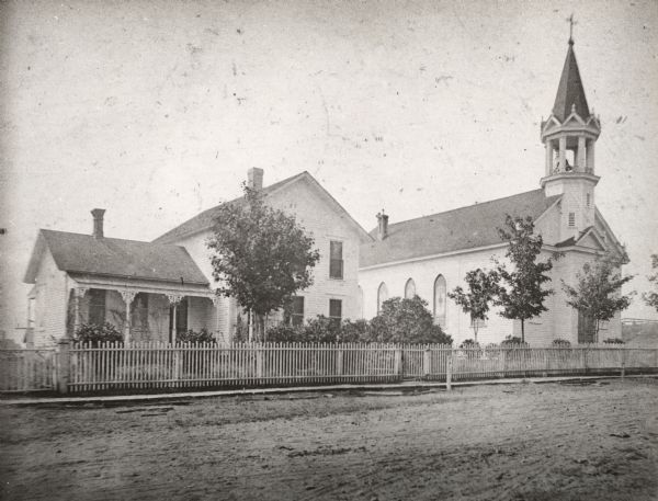 A view of a church and what appears to be the adjoining rectory. This is the Parish of St. Anthony in the town of Fifield.