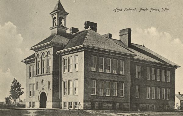 Exterior view of the high school. Caption reads: "High School, Park Falls, Wis."