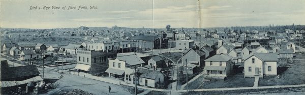 Elevated panoramic view of the town. Caption reads: "Bird's-Eye View of Park Falls, Wis."