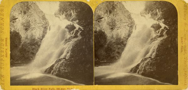 Stereograph of Big Manitou Falls on the Black River. This waterfall reportedly was called "Gitchee Monido" by the Ojibwa, which means "Falls of the Great Spirit."