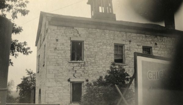 A view of Pewaukee Lake Mills. Asa Clark, a Vermont pioneer who settled in the town of Pewaukee in 1837, erected a sawmill in 1838 at the outlet of the lake. In 1845 he erected a three-story stone flour mill. In 1854, Benjamin Boorman bought it and later enlarged it. At one time his sons ran a cracker factory in conjunction with the mill. After standing empty for many years it was razed in 1927.