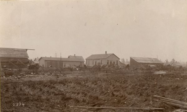 Rebuilding of homes and barns after the fire in 1894.