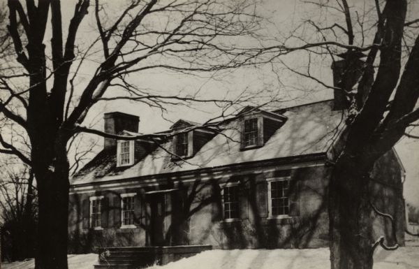 A view of the Mitchell-Rountree house. Built in 1837 for the Rev. Samueal Mitchell under the direction of his daughter's husband, Major John H. roundtree, this house is almost completely unaltered. It is a red brick, two-story Georgian building with a fireplace in every room. A charming house, it is "refined in detail, good in mass, and very quaint."