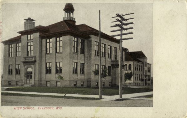 Exterior view of the High School. Caption reads: "High School, Plymouth, Wis."