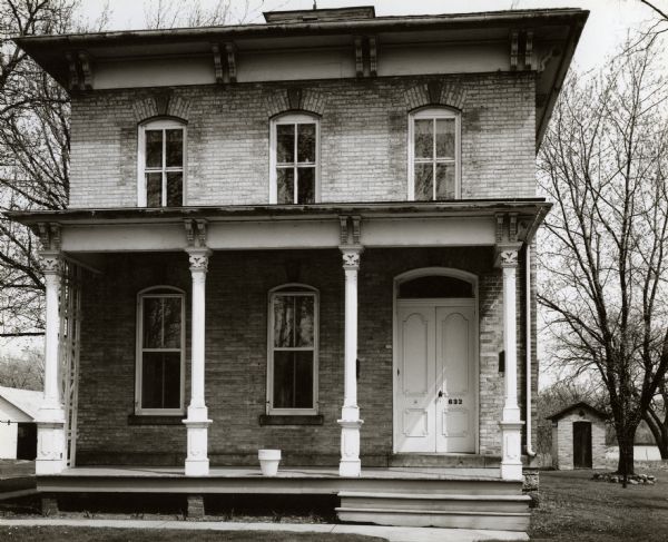 A house with a porch. An example of mid-nineteenth century architecture at 632 East Main Street.