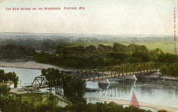 Elevated view of a bridge over the Wisconsin River. Caption reads: "The New Bridge on the Wisconsin, Portage, Wis."