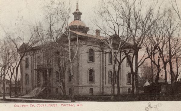 View across street towards the Columbia County Court House. Caption reads: "Columbia Co. Court House, Portage, Wis."