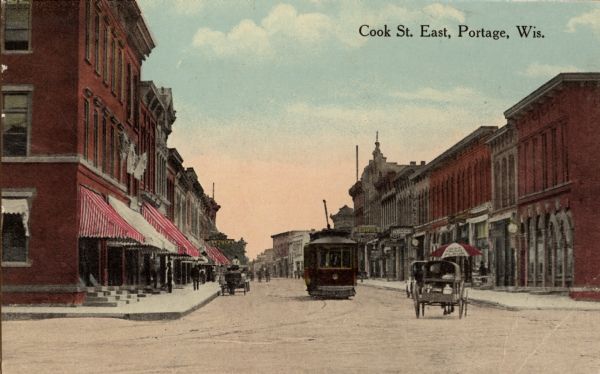 View looking down Cook Street looking east. Caption reads: "Cook St. East, Portage, Wis."