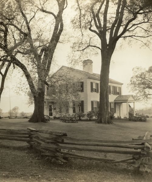 View over fence towards the house that served as the residence for John and Juliette Kinzie after 1829 when he was appointed as federal Indian Agent. She authored the book, "Wau-bun," which gives an account of their lives here between 1830-1833.